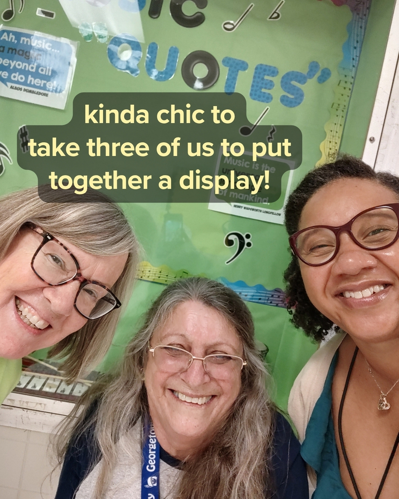 Mrs. Daniel, Mrs. Lombard, and Mrs. Dunning pose in front of their bulletin board - Kinda chic to take three of us to put together a display!