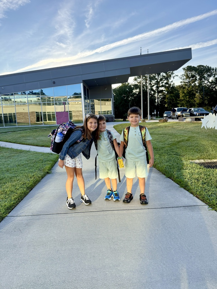 Parent drop off students walking into school