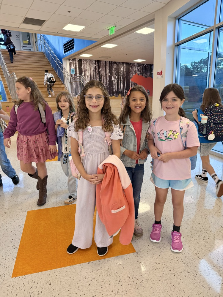 Friends posing for the first day of school