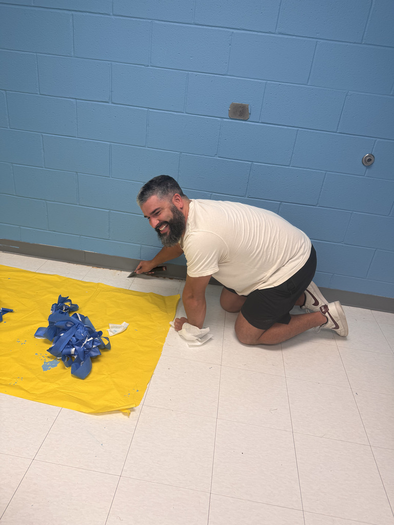 pastor removing painter's tape