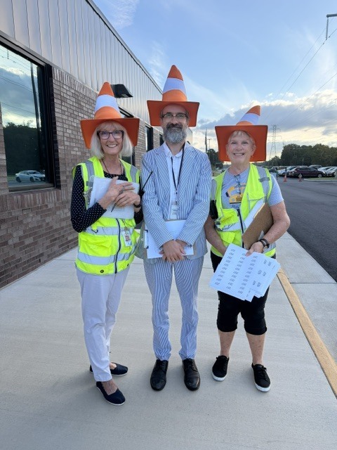 teachers wearing traffic cone hats