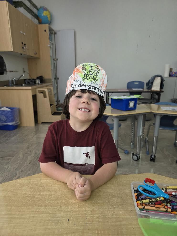 proud kindergartener on the first day of school