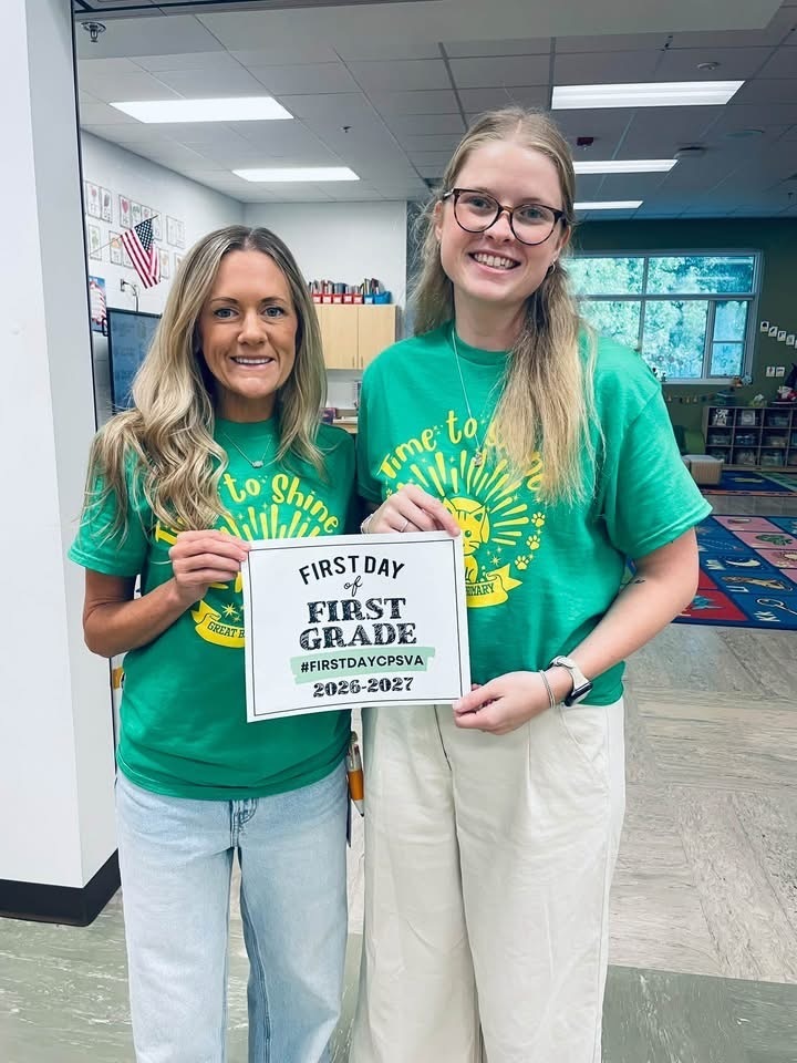 Mrs. Warber and Mrs. Jennings posing on their first day of first grade.
