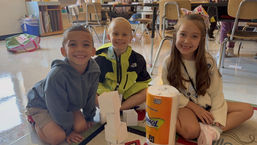 Students work together to build a structure