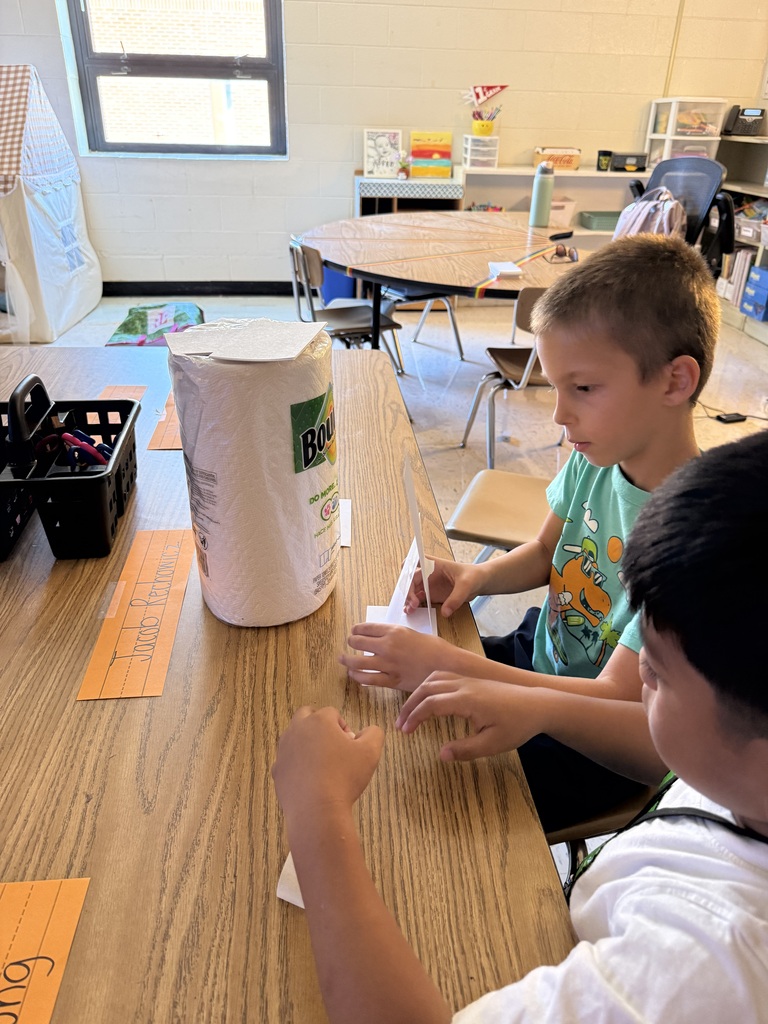 Students work together to build a structure
