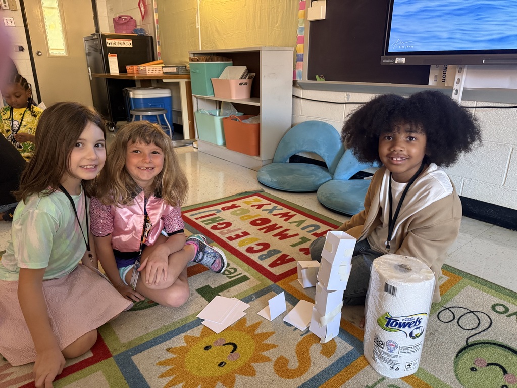 Students work together to build a structure
