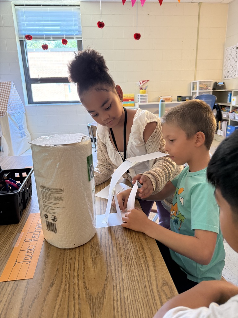 Students work together to build a structure