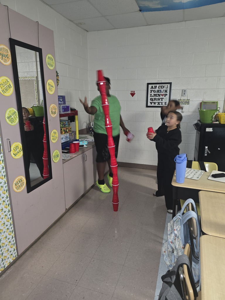 Kids building cup towers