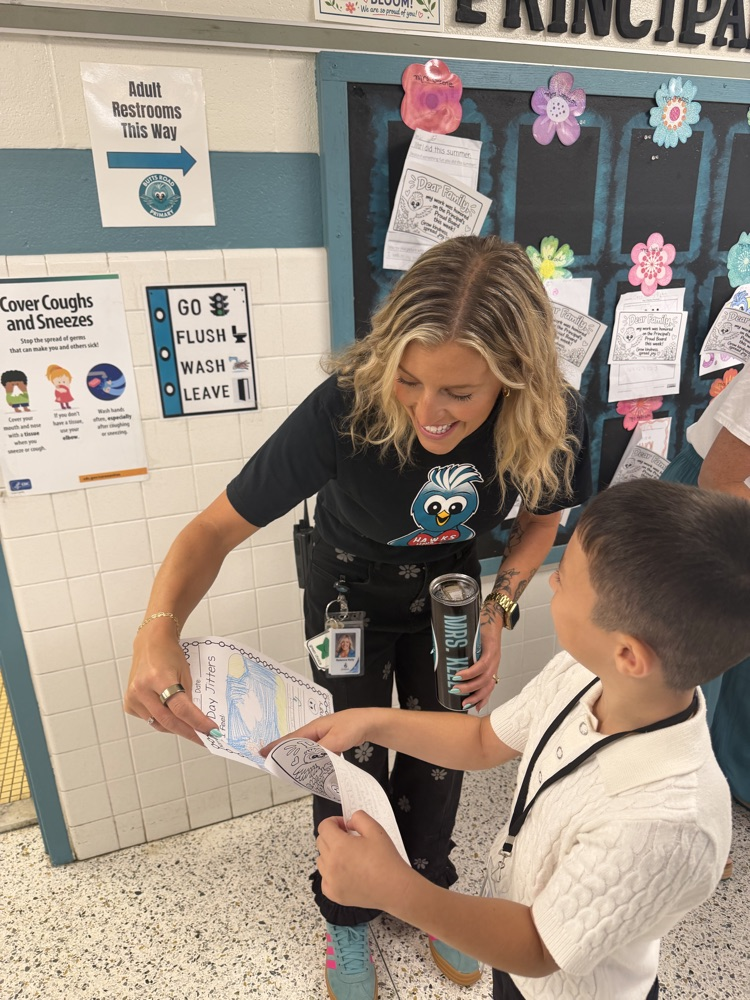 mrs. Kelley doing principal’s pride board