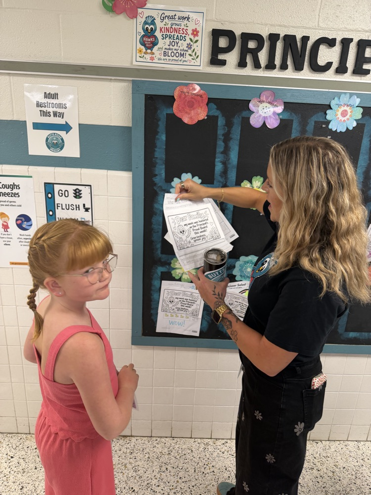 mrs. Kelley looking at student work