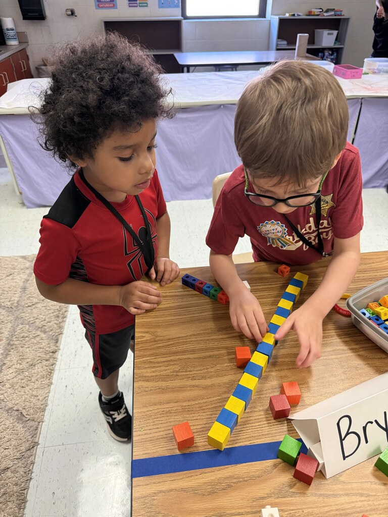 Students playing with cubes