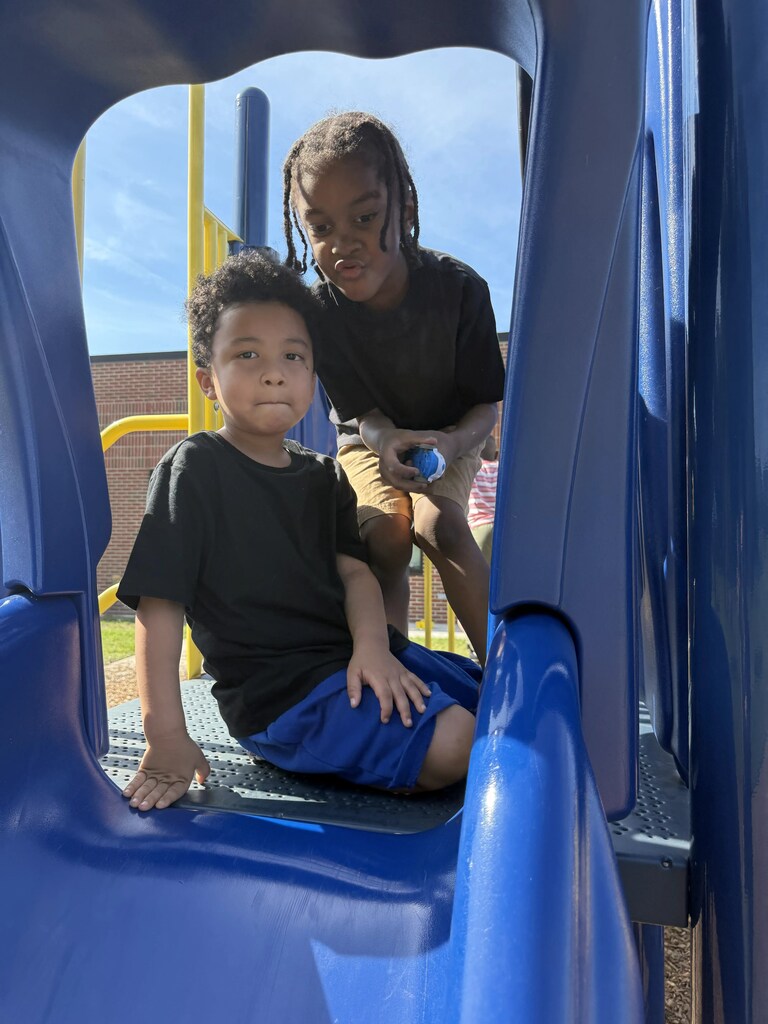 Students on the slide