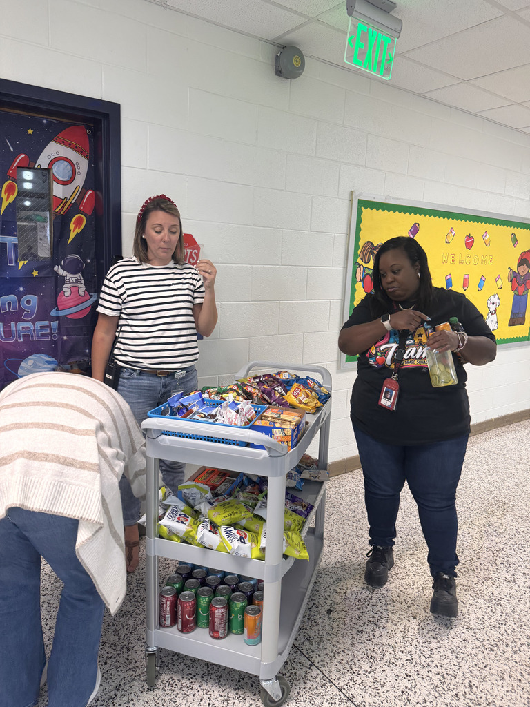 staff choose snacks from cart