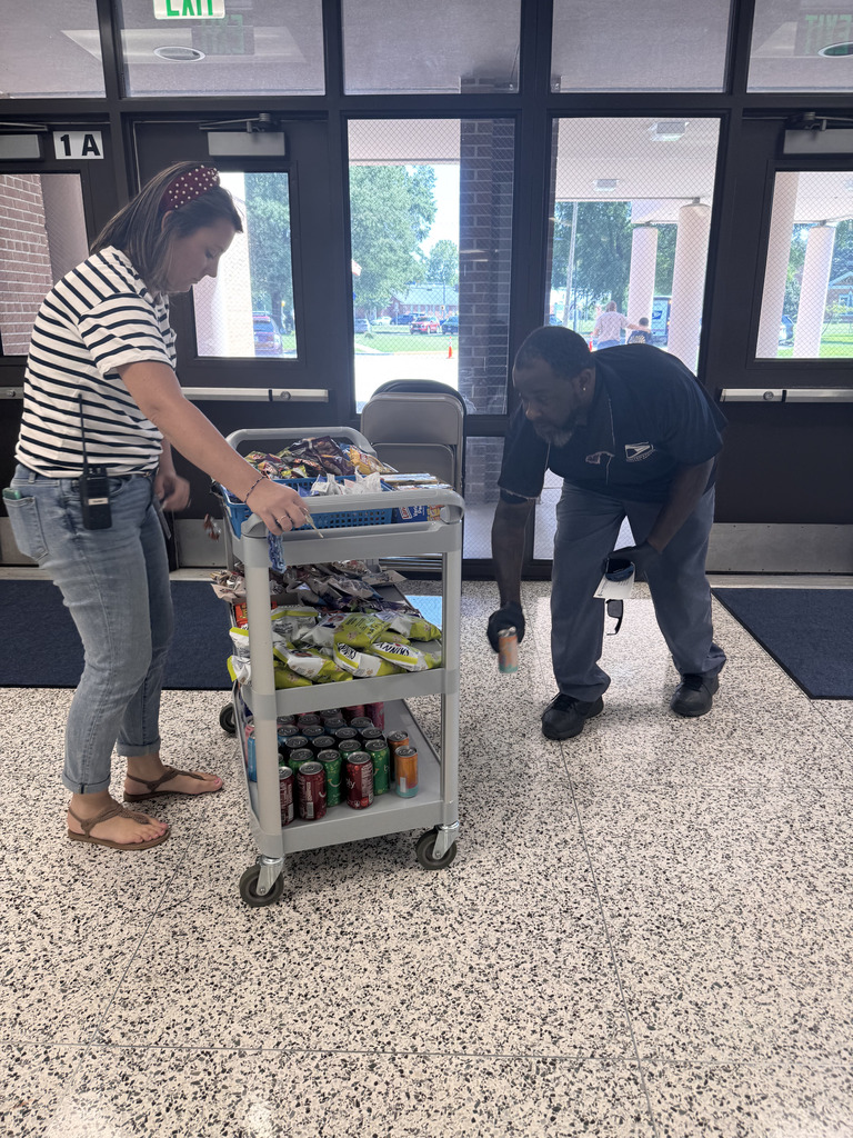 postal worker chooses snack from cart