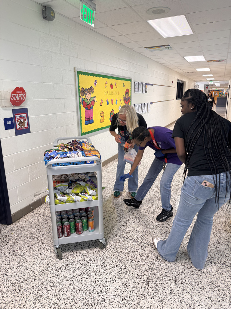 staff choose snacks from the snack cart