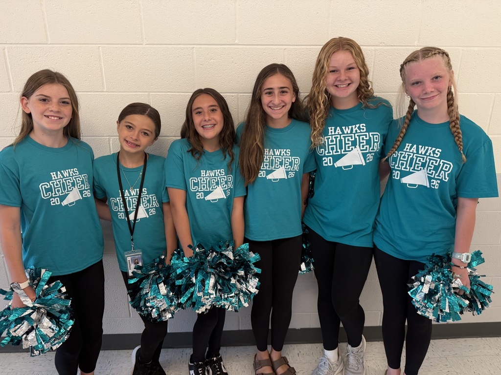 cheerleaders smiling and welcoming students in the morning