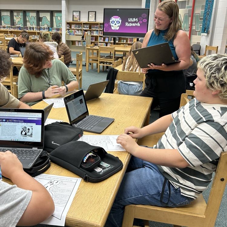 students researching in the library