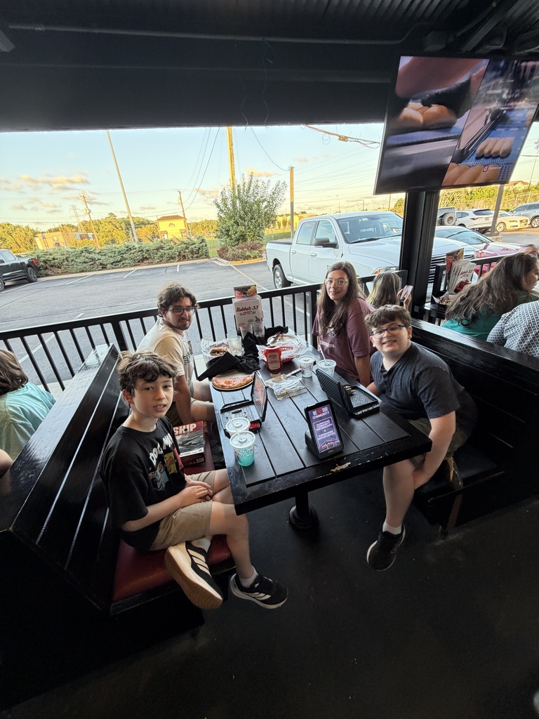 family enjoying dinner at Bubba's 33