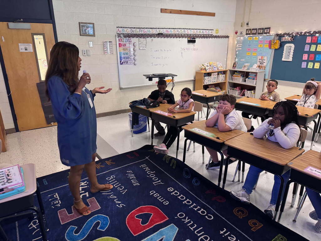 Principal Alexander speaking to second grade students