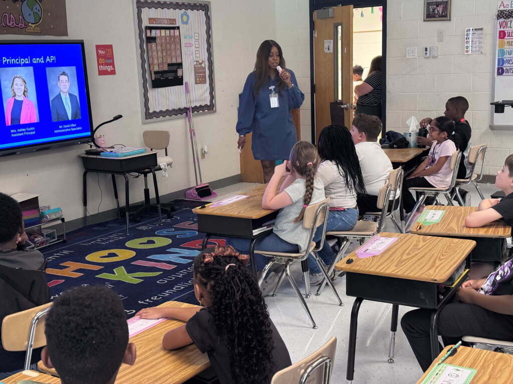 Principal Alexander speaking to second grade students