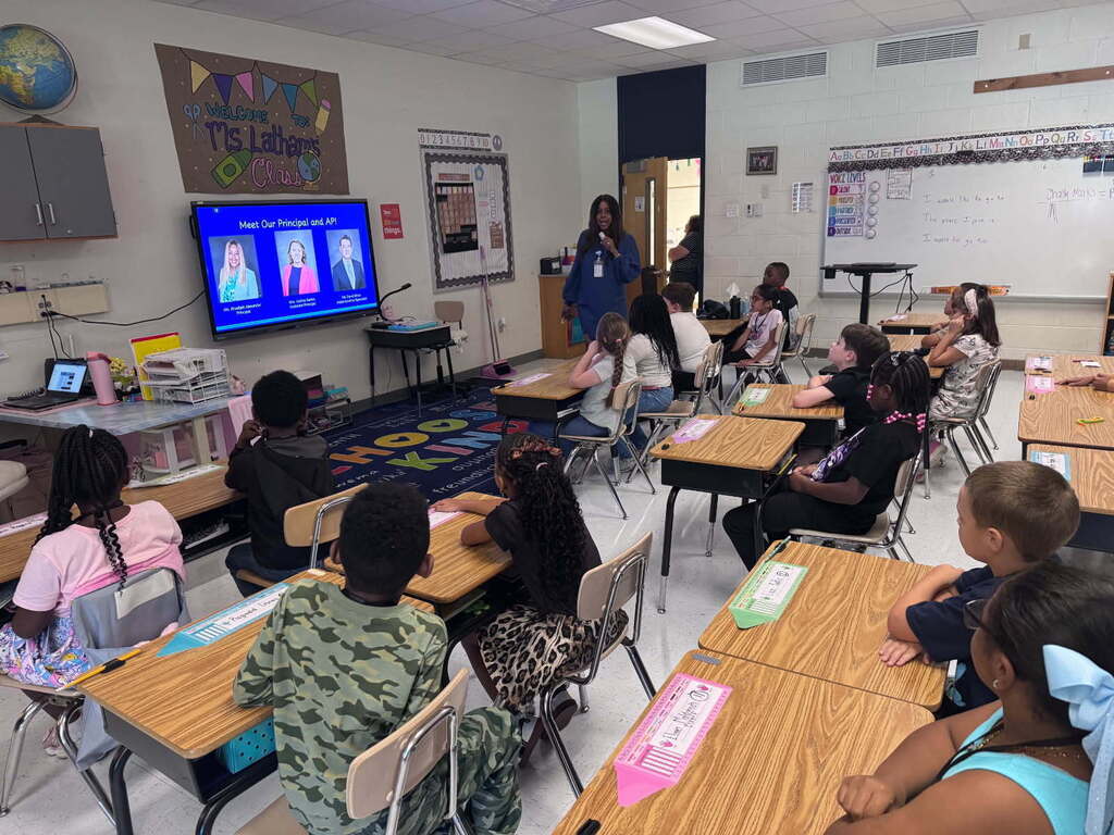 Principal Alexander speaking to second grade students