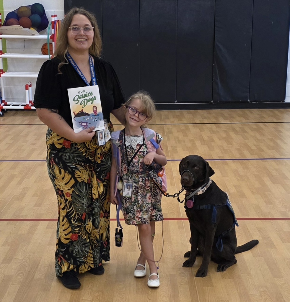 Mrs. Weaver, Lila, and Gracey the service dog during school presentations.