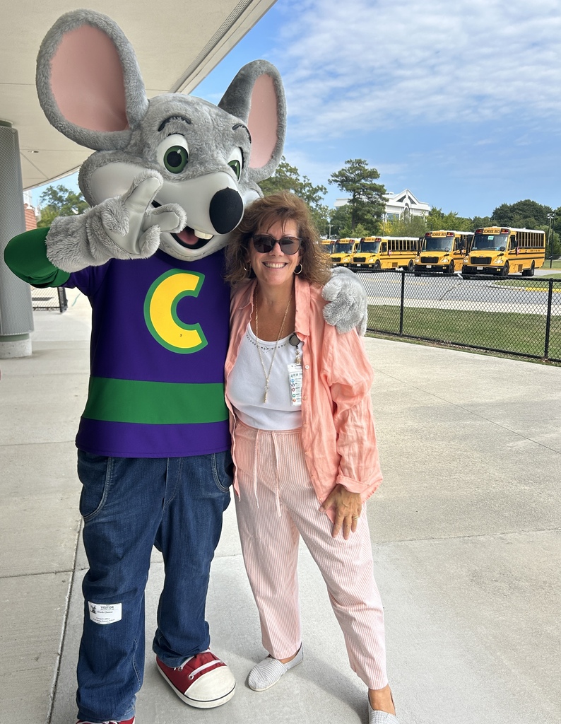 TA Mrs. Jones posing with Chuck E Cheese at parent pick up in preparation for tonight's PTA fundraiser.