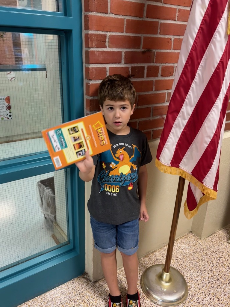 student holding book