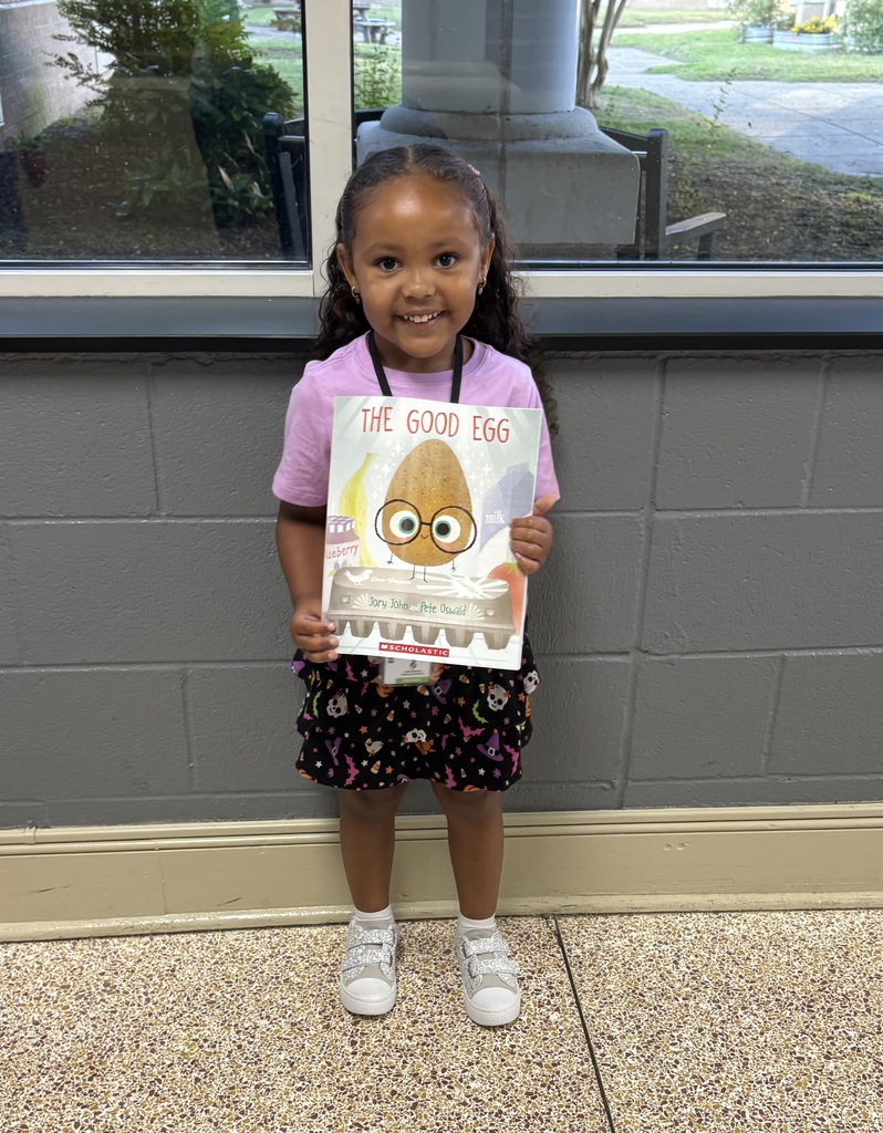student holding book