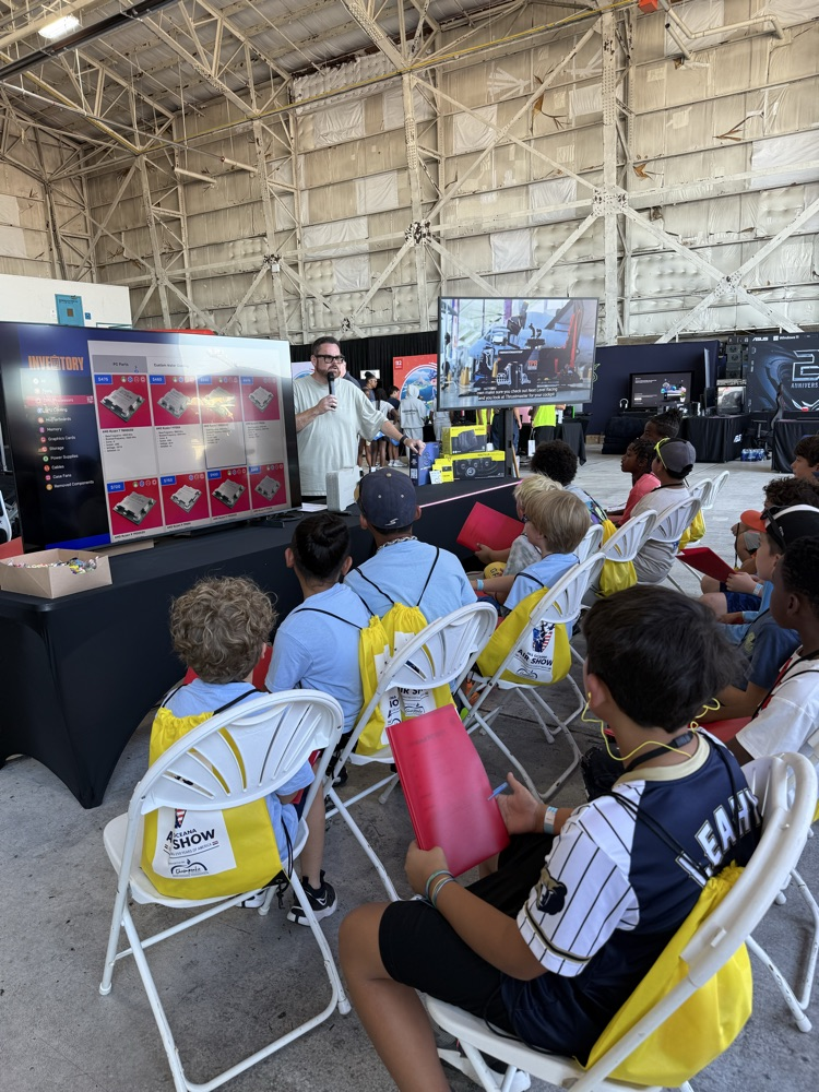 students enjoying a presentation at the technology section of the airshow