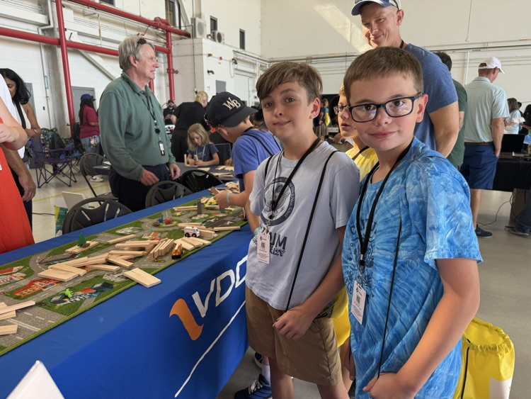 students enjoying a presentation at the technology section of the airshow