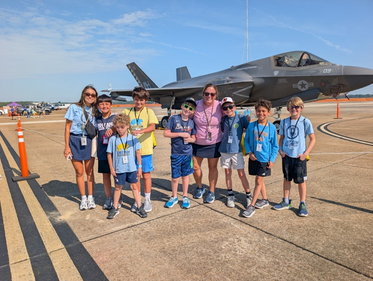 Smiling in front of a large aircraft at the airshow