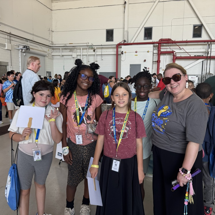 5th graders and their teacher posing for a picture.