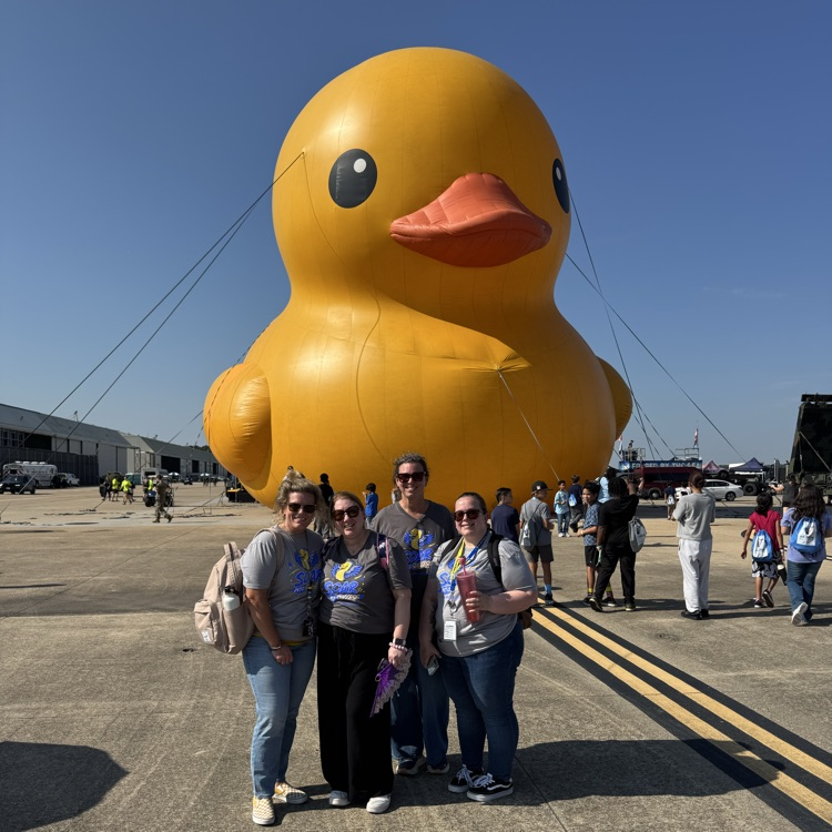 5th grade teachers posing in front of the giant inflatable duck.