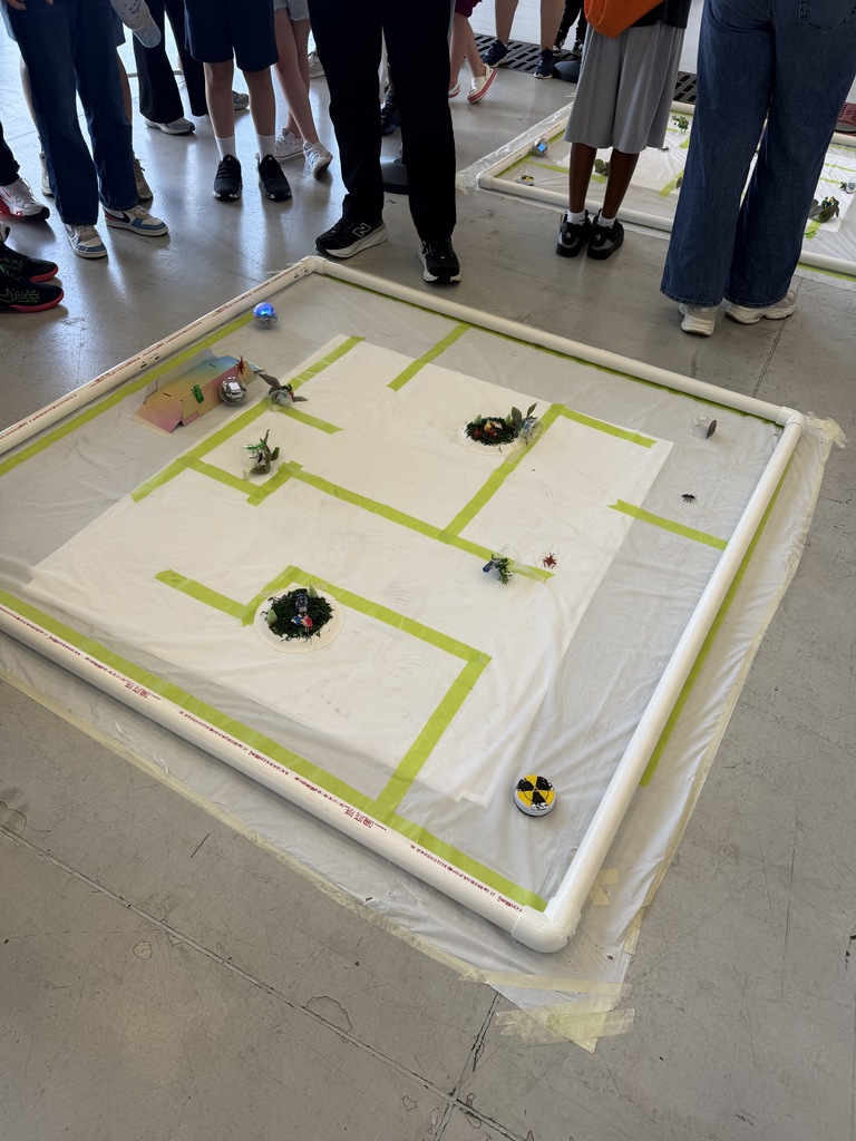 Sphero robot maze where students try to program the robot to travel around the maze.