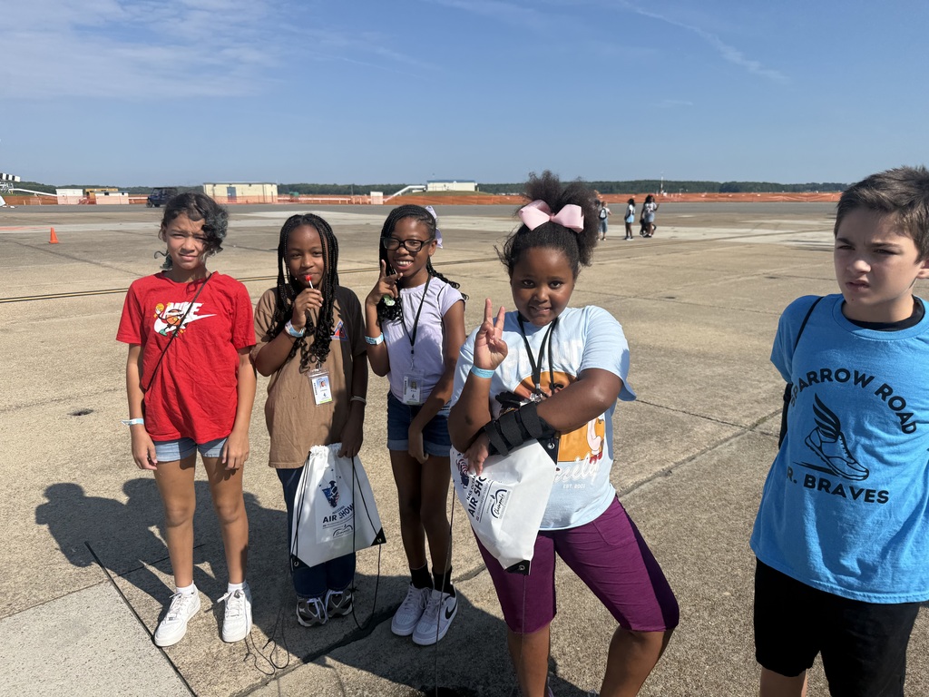 Students standing together on a runway for the Oceana Air Show.