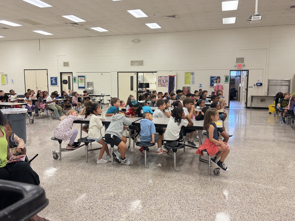 Group of students listening to behavior assembly
