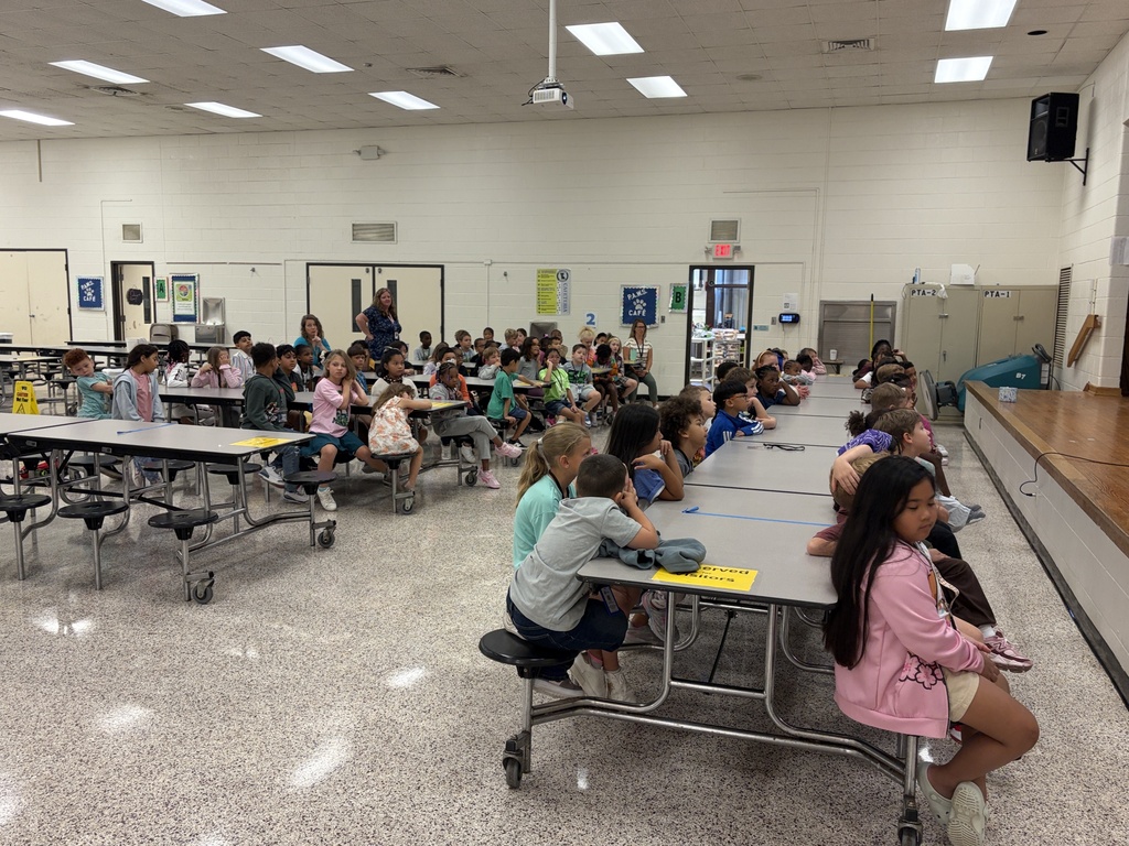 Group of students listening to behavior assembly