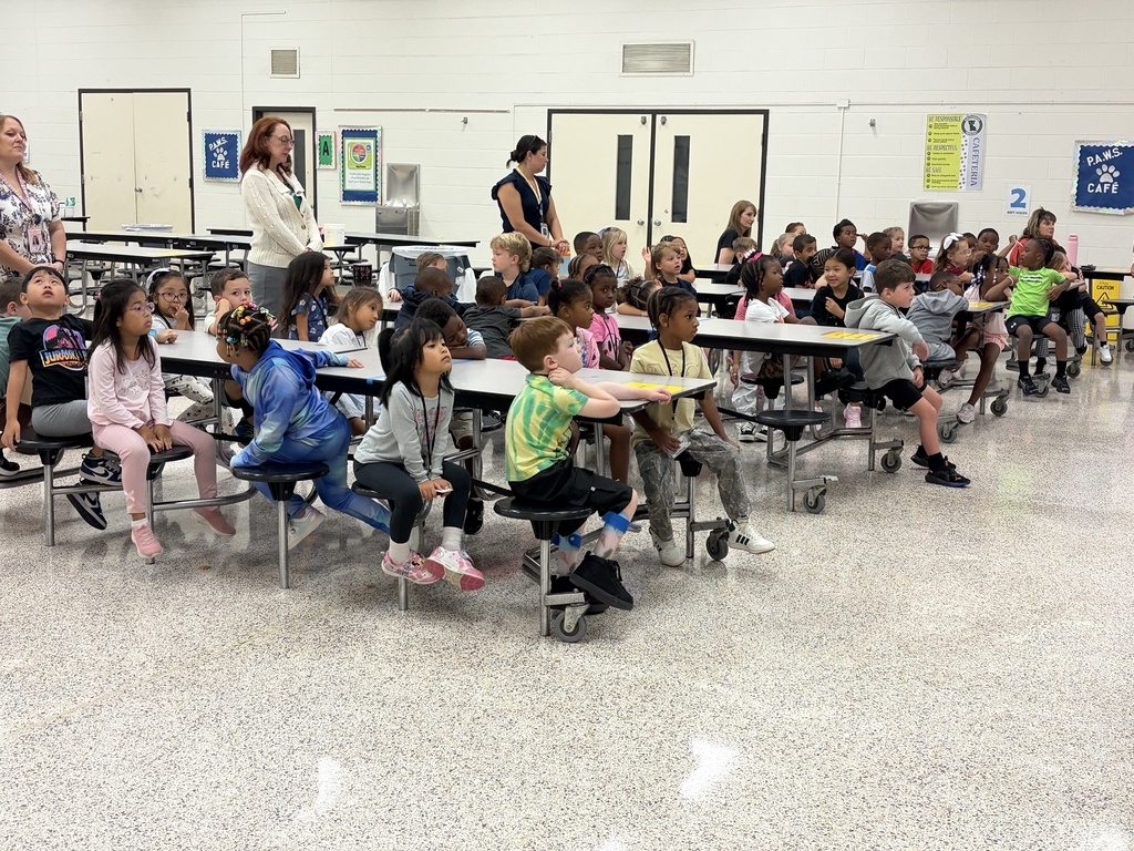 Group of students listening to behavior assembly