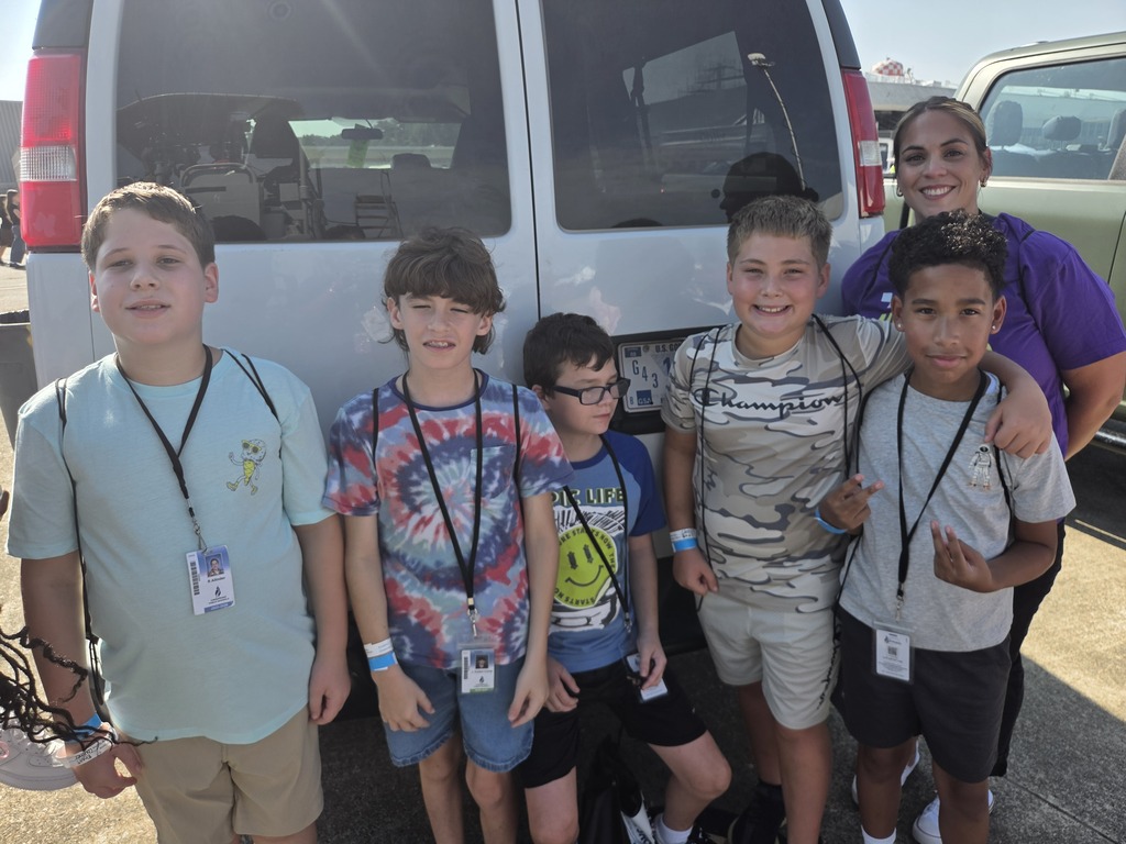 students posing with their teacher at the NAS Oceana Air Show