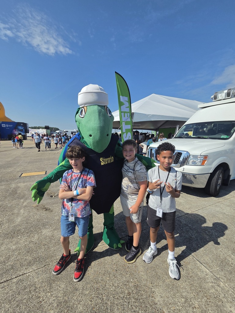students posing with a mascot at the NAS Oceana Air Show