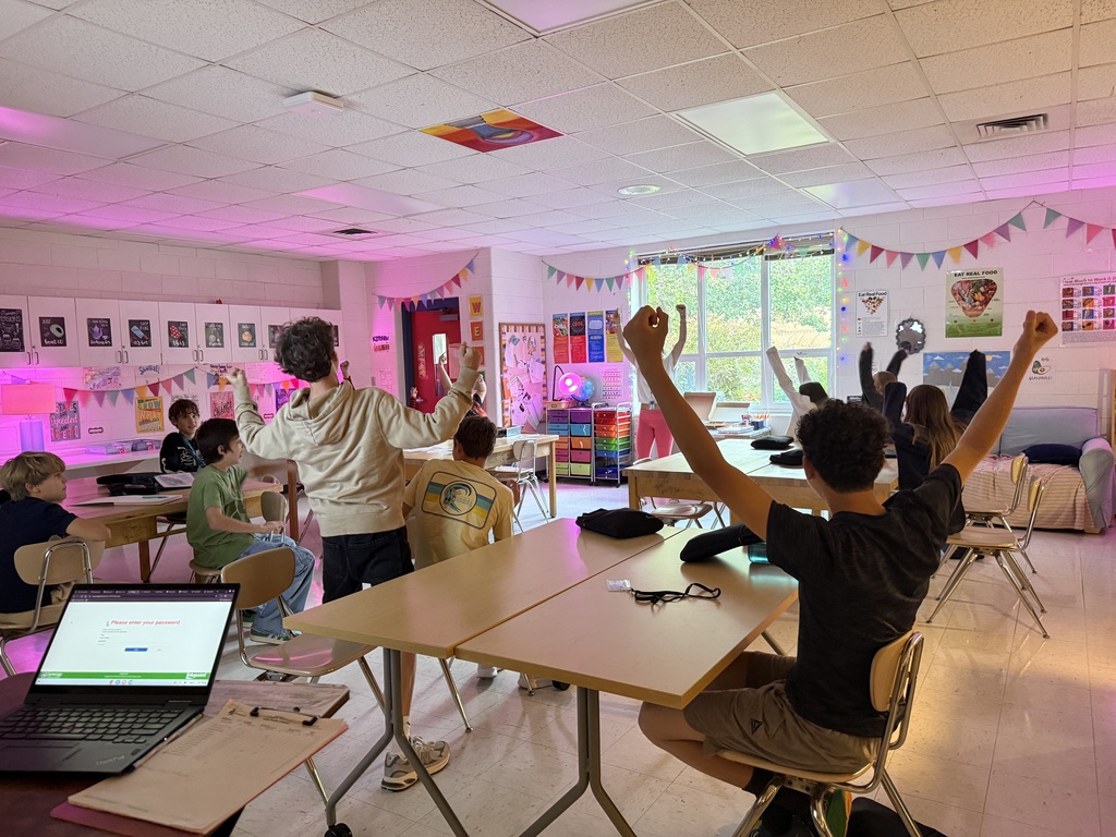 students cheering on their team in the fun game