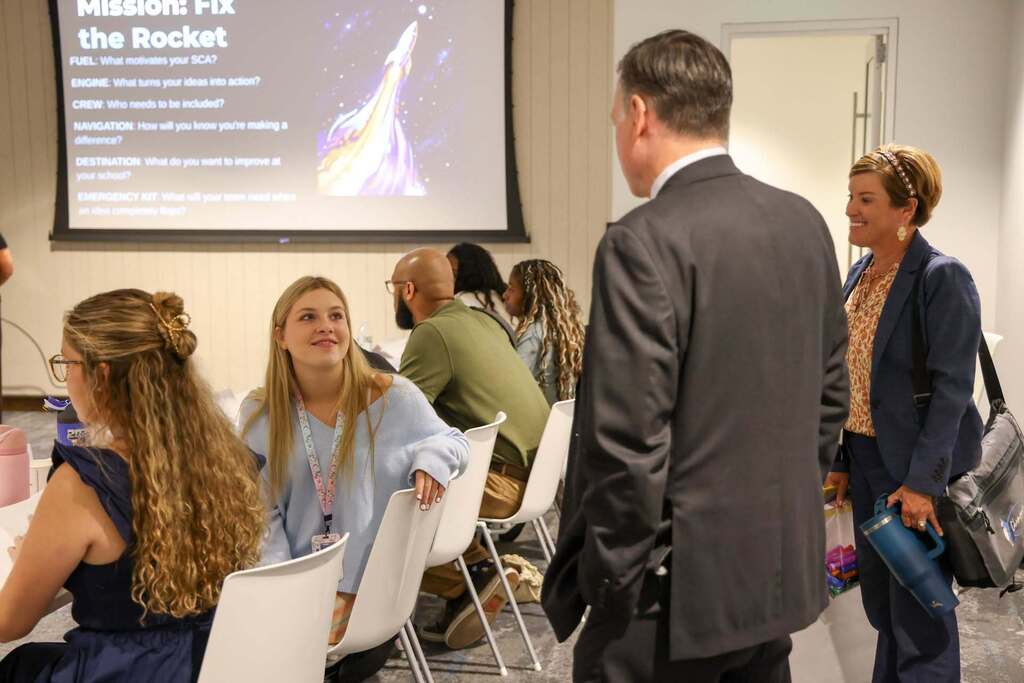 SCA member and the Superintendent speaking with one another.