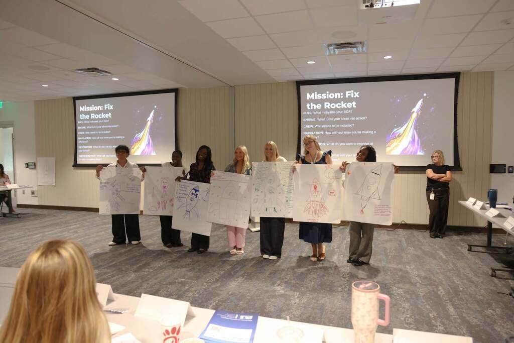 SCA members presenting their activity results to the group.