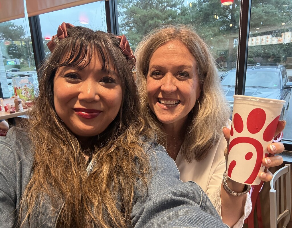 Two ladies one holding chick-fil-a cup