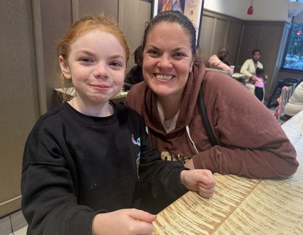 Mother and daughter waiting at chick-fil-a fundraiser