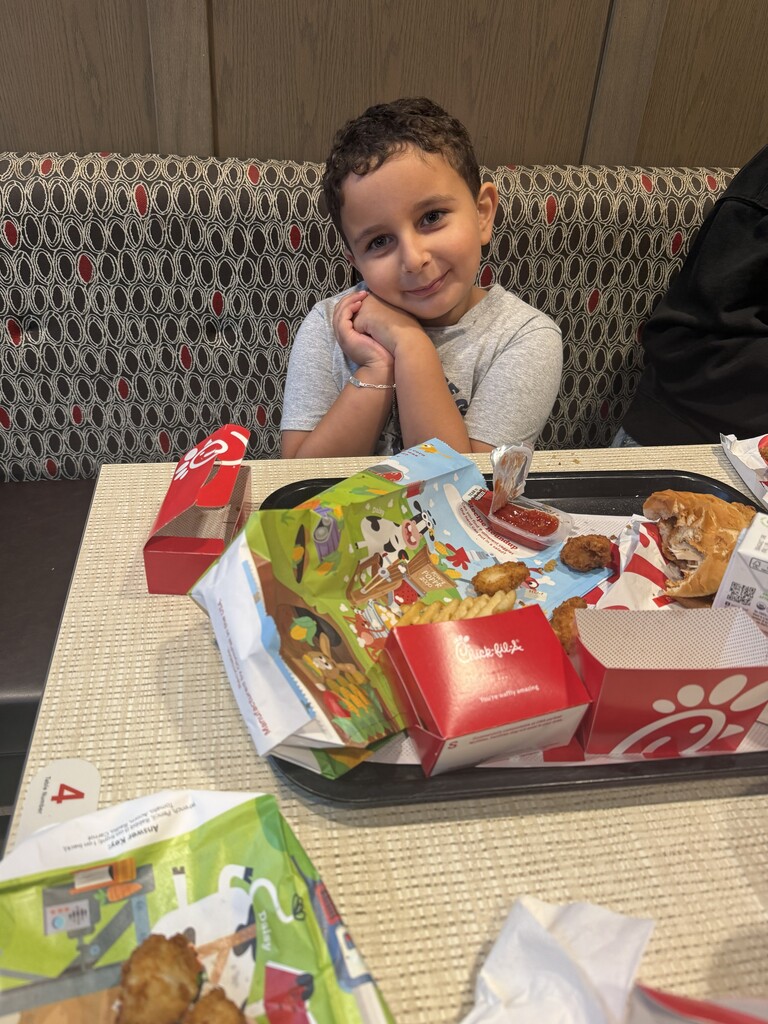 Young boy eating chick-fil-a