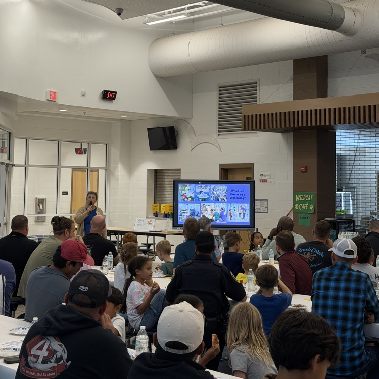 Mrs. Taylor presenting about the Watch Dogs program to the dads and their students last night.