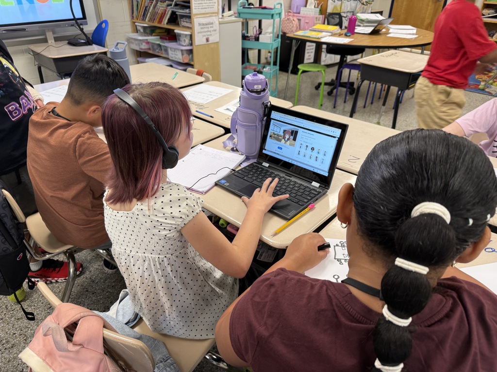 Students working on group PBIS project in class.