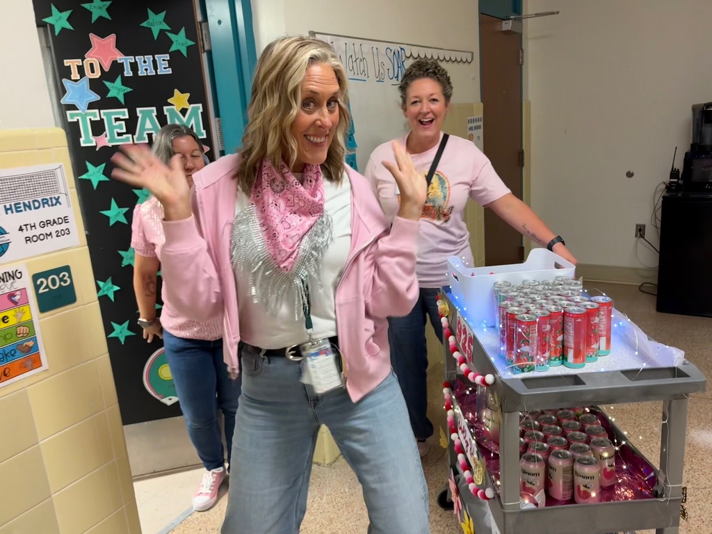admin passing out treats to staff